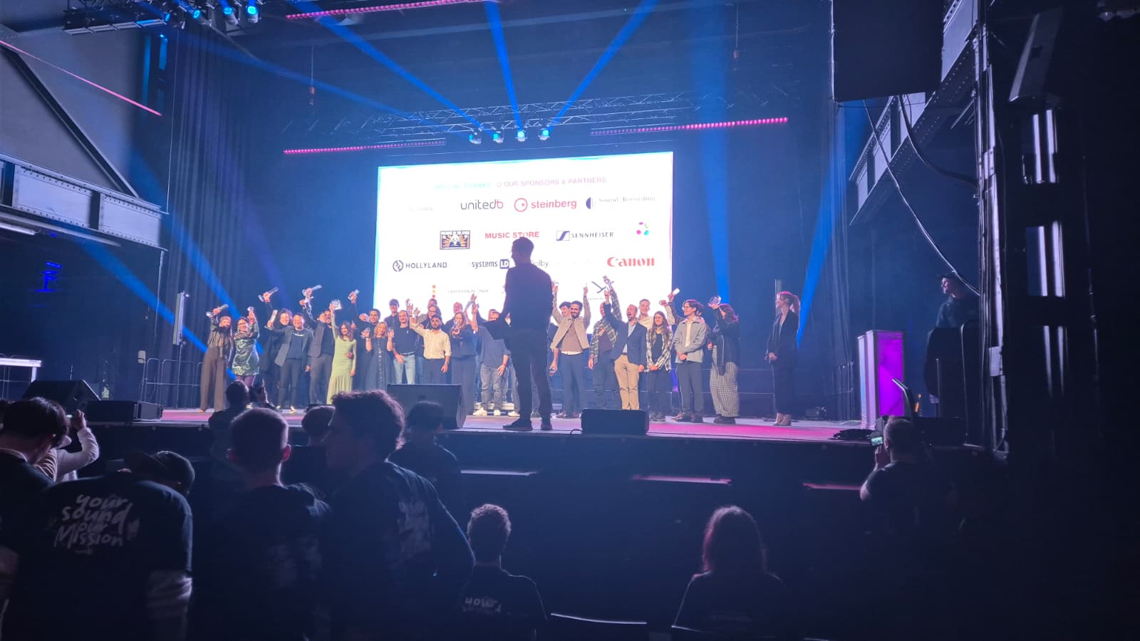 Final photo of the ceremony with all the winners from each SAE school around the world.